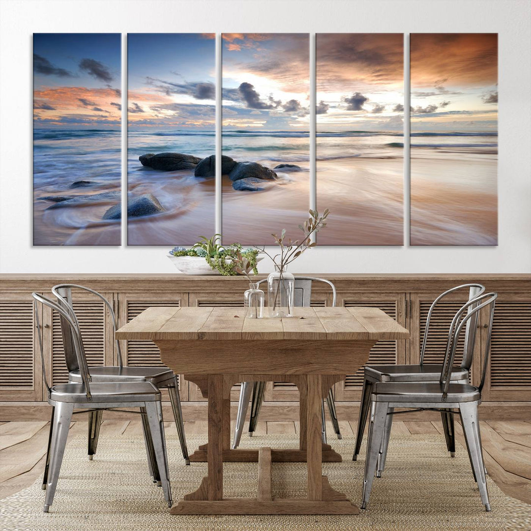 The "Serene Weather On The Beach Wall Art Canvas Print," featuring a tranquil beach scene with rocks and waves, is ready to hang and enjoy.