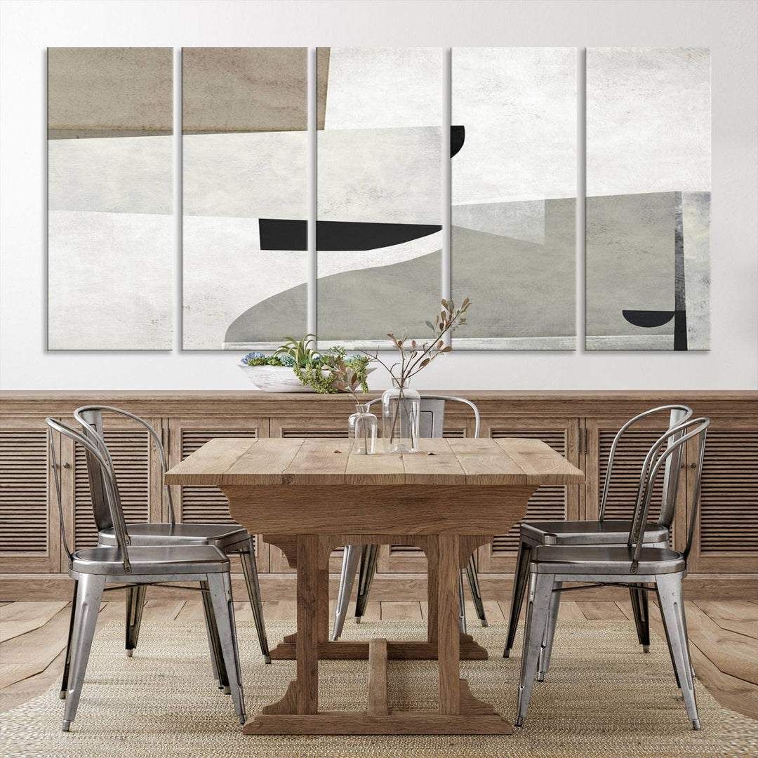 The Brown Gray Figures Abstract Wall Art Canvas Print is displayed as a triptych on a dark wall. The piece is gallery wrapped, offering a seamless finish and enhanced durability due to its UV-protective coating.