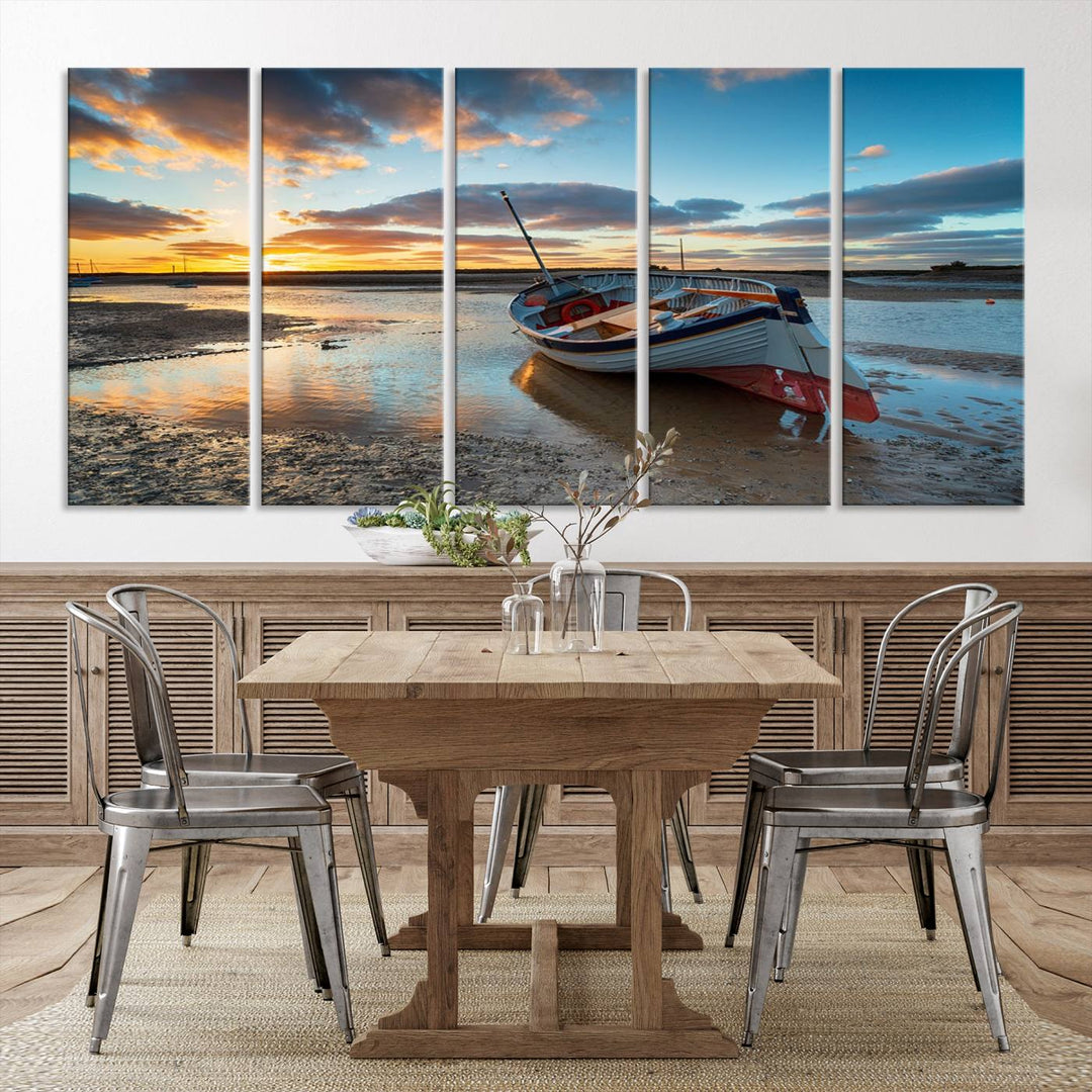 The "Small Boat At The Beach Sunset Wall Art Canvas Print," a three-panel masterpiece crafted on museum-quality canvas, hangs elegantly.