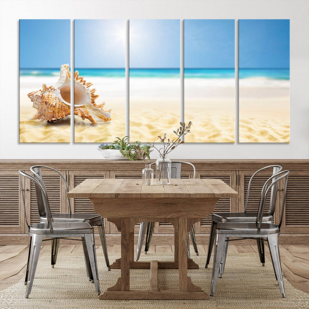 The Sea Shell on The Beach Sun Sand Wall Art Canvas Print is a triptych that beautifully captures a beach scene with a large seashell on the sand.