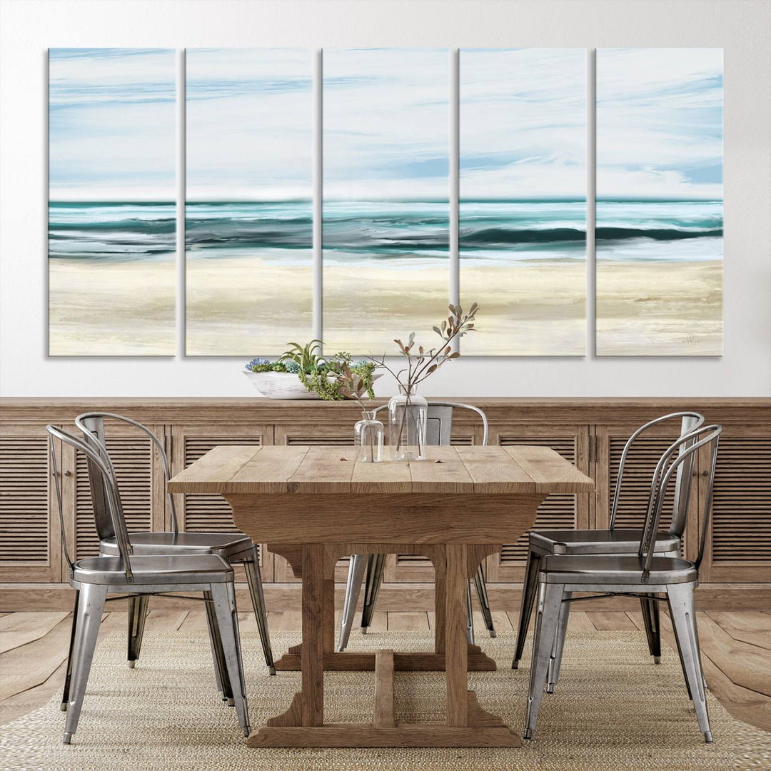 The room features the Ocean Abstract Wall Art Canvas Print, a triptych beach painting on museum-quality canvas with a gallery-wrapped finish and UV-protective coating.