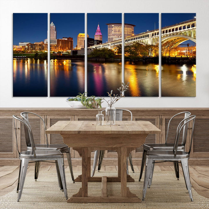 The "Cleveland Night Skyline Wall Art City Cityscape Canvas Print" is a striking feature in the room, showcasing a city skyline with a bridge reflecting in a river. Displayed on museum-quality canvas, it offers enduring beauty.