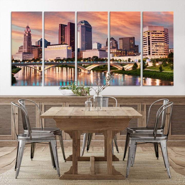 The "Columbus City Lights Sunset Orange Cloudy Skyline Cityscape View" wall art is featured on the wall. This triptych is printed on museum-quality canvas and includes a UV-protective coating, ensuring lasting vibrancy.