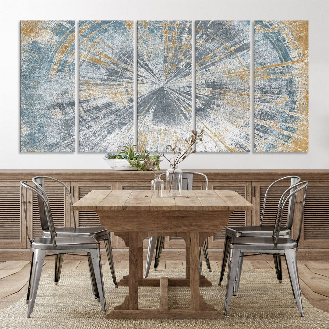 The Radiant Abstract Wood Rings Canvas Art, a modern triptych wall decor, enhances the contemporary style of the living room with its blue, white, and gold hues.