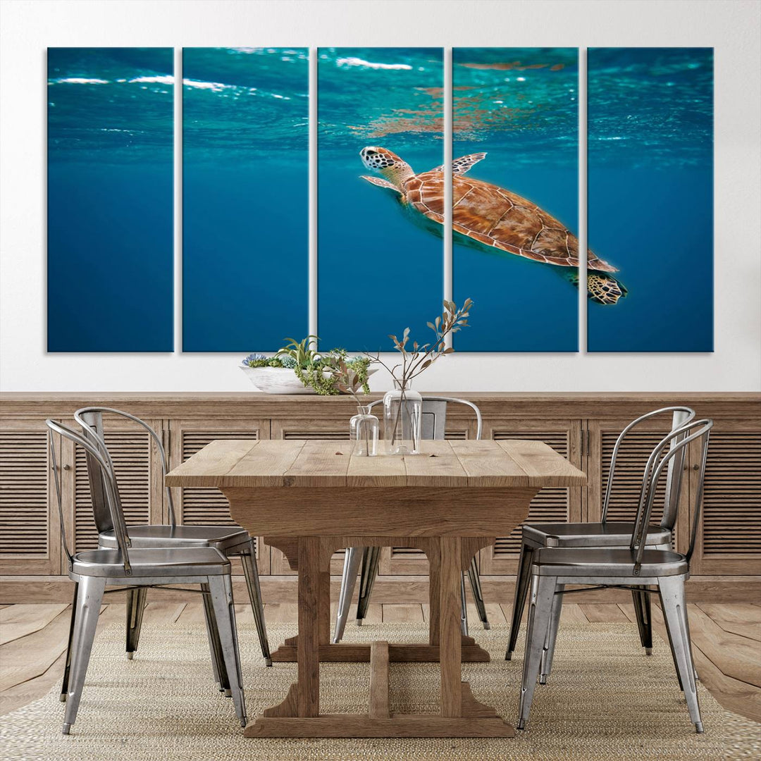 The living room features the "Baby Turtle in Ocean" wall art canvas print. This gallery-quality piece, depicting a sea turtle swimming underwater, adds an elegant touch to the space.