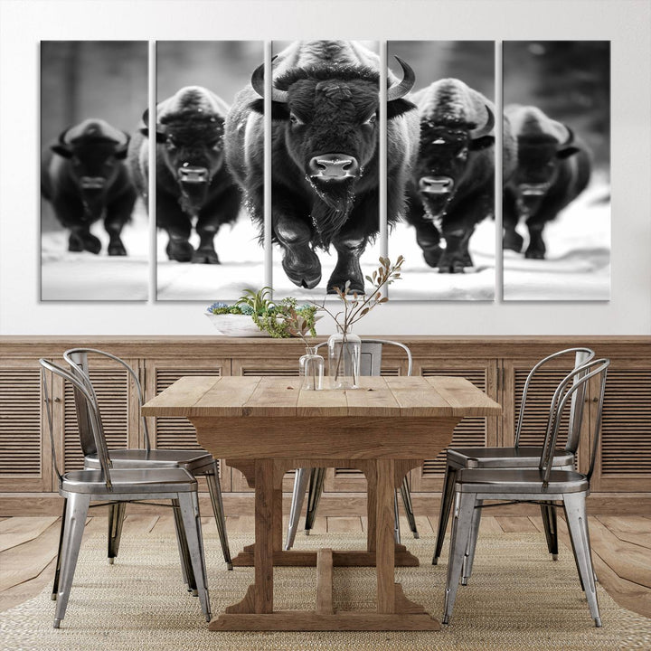 A modern living room features a striking black-and-white American Bison Art | Buffalo Herd Wall Art Canvas Print on the wall.