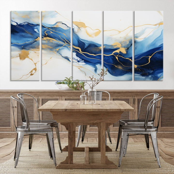 The Blue Abstract Wall Art is displayed as a triptych on museum-quality canvas, showcasing a blue and gold abstract design. The artwork includes a UV-protective coating to maintain its vibrancy and comes with the benefit of free shipping.