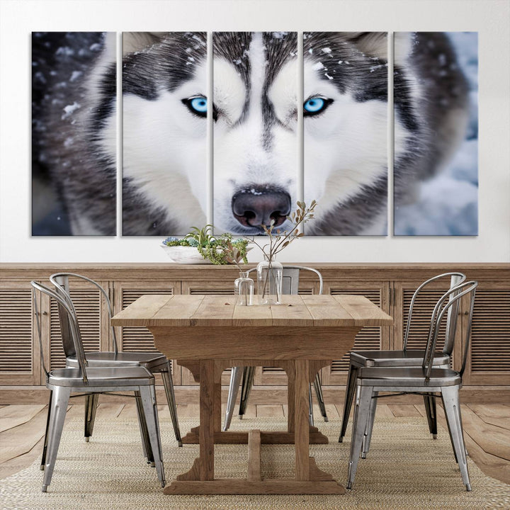 A large framed Winter Siberian Husky Wolf Wall Art Canvas Print, an exquisite piece of animal portrait decor, hangs prominently on the wall.