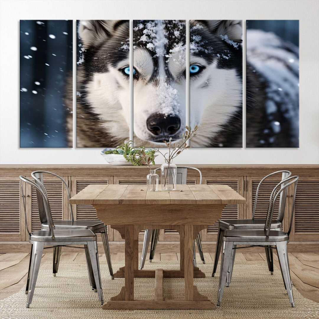 A digital art piece titled "Winter Siberian Husky Wolf Wall Art Canvas Print" showcases a blue-eyed husky blanketed in snow. Printed on high-quality canvas, it is an ideal choice for nature and dog enthusiasts.