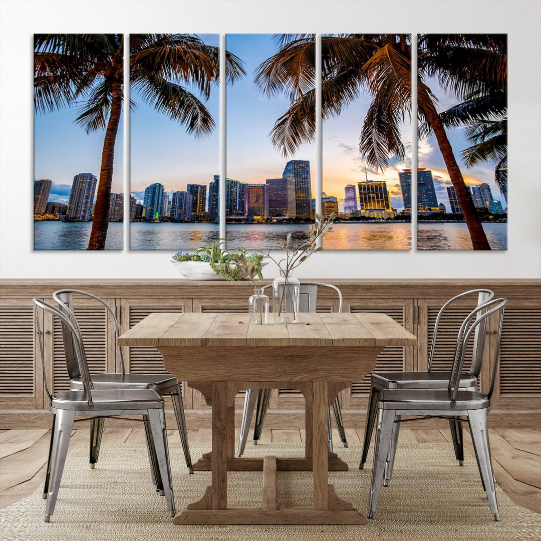 The Wall Art MIAMI Canvas Print features a triptych design depicting palm trees and a city skyline at sunset.