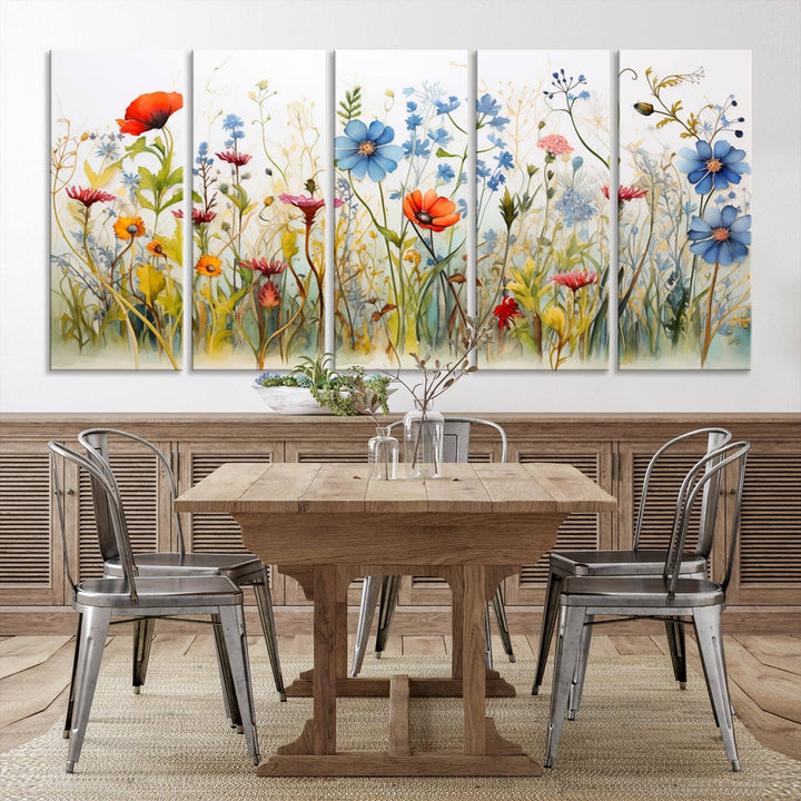 The Colorful Wildflower Canvas Wall Art – Vibrant Floral Botanical Print, consisting of a large 3 panel set, adds bright nature decor to the living room against a black wall.