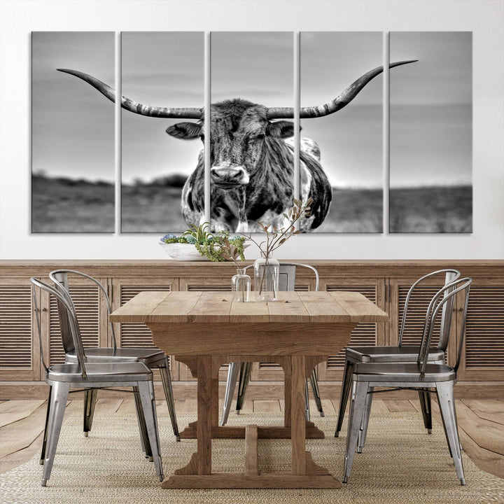 The Texas Longhorn Cow Wall Art, featuring a black and white image of a longhorn bull on canvas, brings charm to the room with its sophisticated appeal.