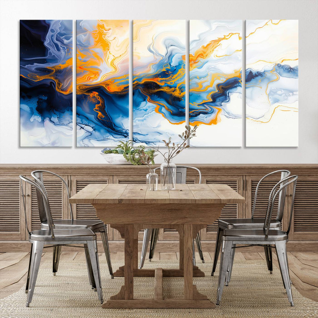 A stunning Fluid Alcohol Ink Wall Art with Gold Wall Art Canvas Print, featuring vibrant blue, orange, and white swirls, adorns the wall. This gallery-quality finish adds an exquisite touch to any living space.