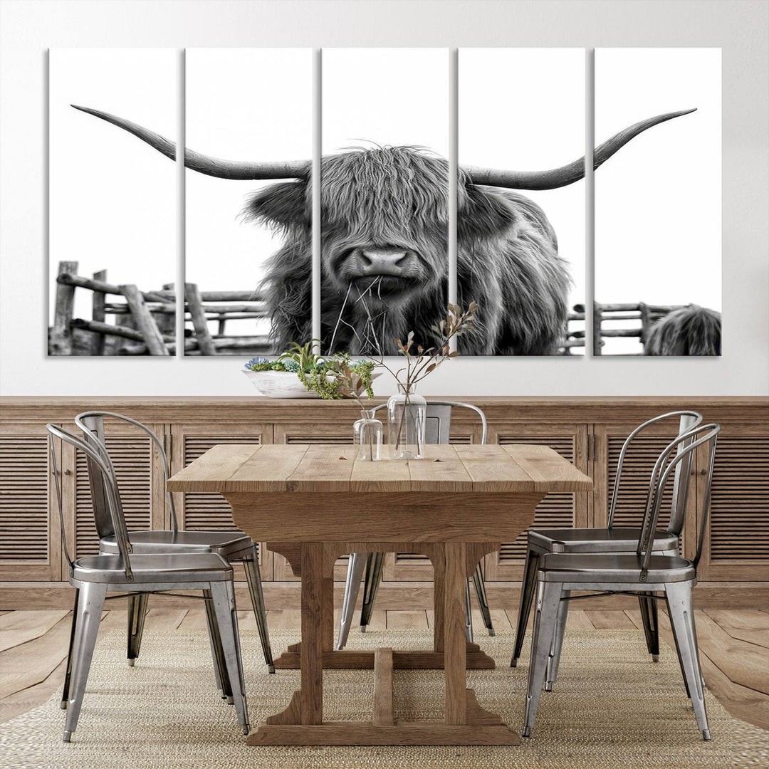 The Longhorn Canvas Print, featuring a black-and-white triptych of a Bighorn cow with shaggy fur and impressive long horns, is elegantly showcased. This wall art piece boasts a gallery-quality finish on premium canvas, bringing sophistication to any room.