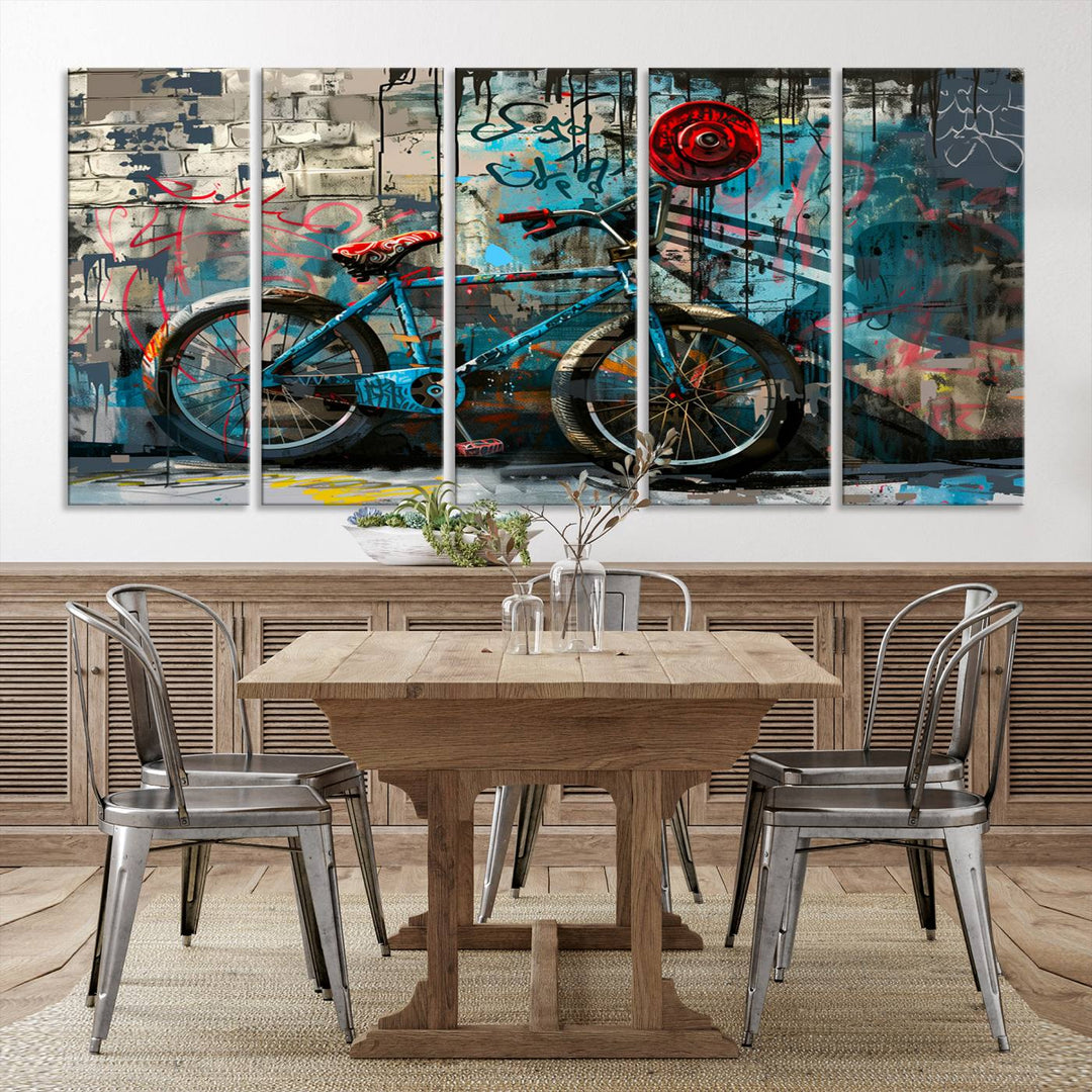 A modern living room features a triptych wall art of an abstract bicycle, designed in a graffiti style on a brick wall. This piece is expertly crafted on the Abstract Bicycle Wall Art Canvas Print, offering a premium canvas that ensures a gallery-quality finish.