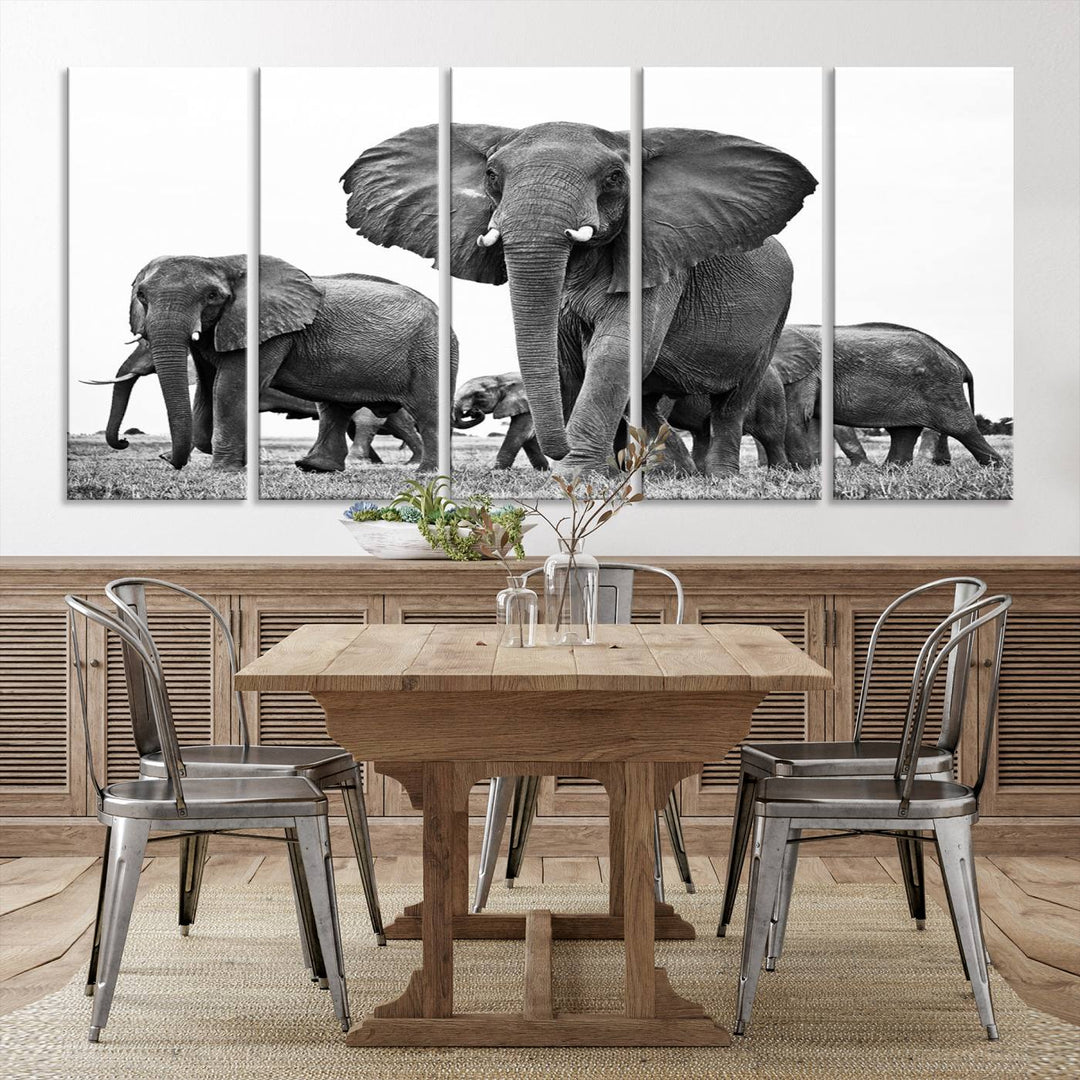 The Black White Elephant Family Wall Art Canvas Print features a triptych of elephants walking in the wild, crafted as gallery-quality wall art on premium canvas.