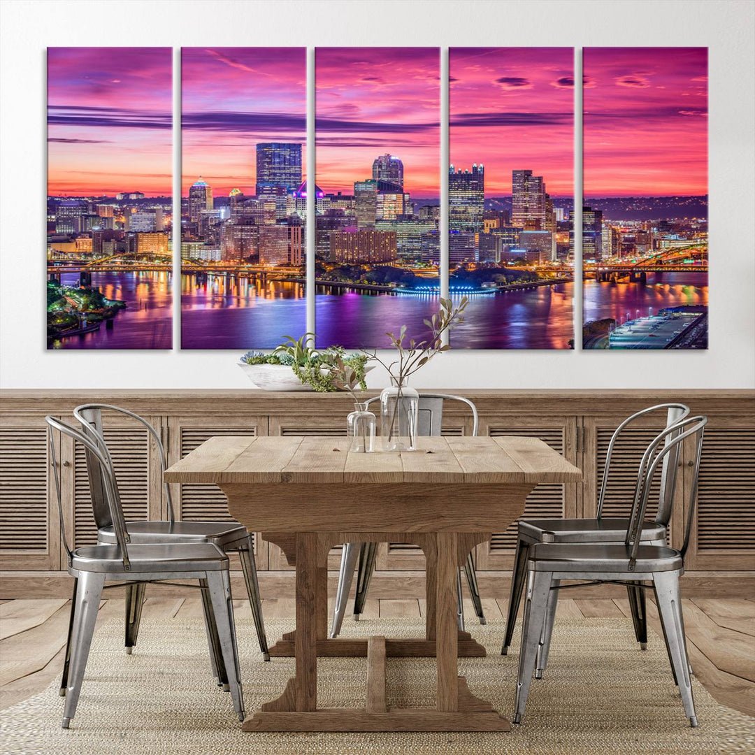 The Pittsburg Wall Art Canvas Print, showcasing a vibrant sunset glow over the city skyline and crafted by a professional artisan, adorns the space.