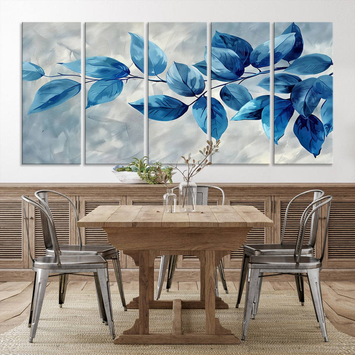 A Blue Leaf Abstract Wall Art Canvas Print, featuring a textured background and gallery-quality finish, is displayed.