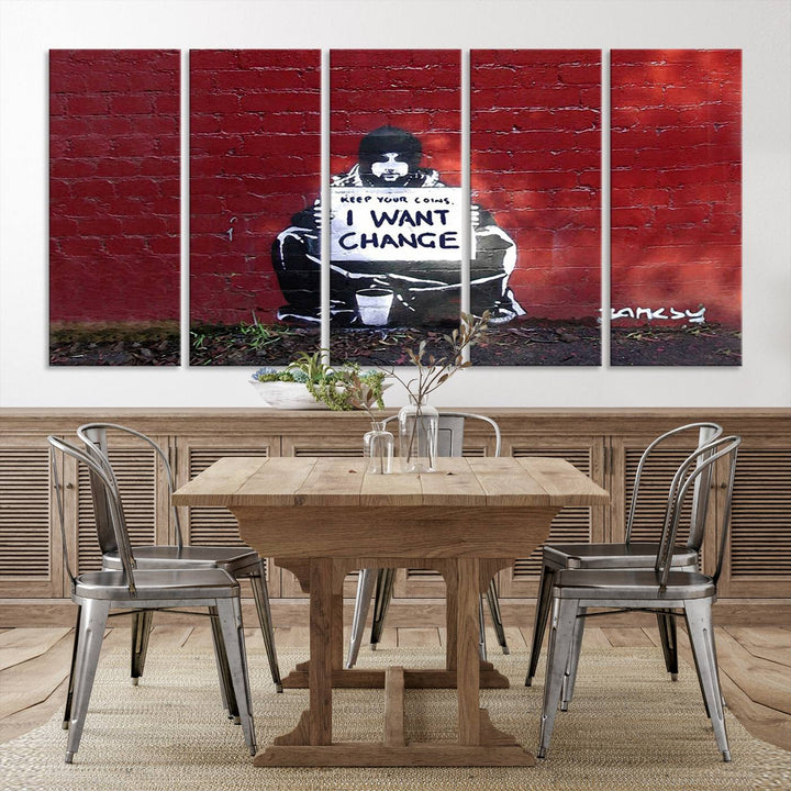 The living room showcases a triptych of stencil artwork on museum-quality canvas, featuring the Banksy I Want Change Graffiti Abstract Wall Art Canvas Print. This captivating piece depicts a person holding a sign that says "I want change" and is finished with a UV-protective coating to ensure long-lasting beauty.