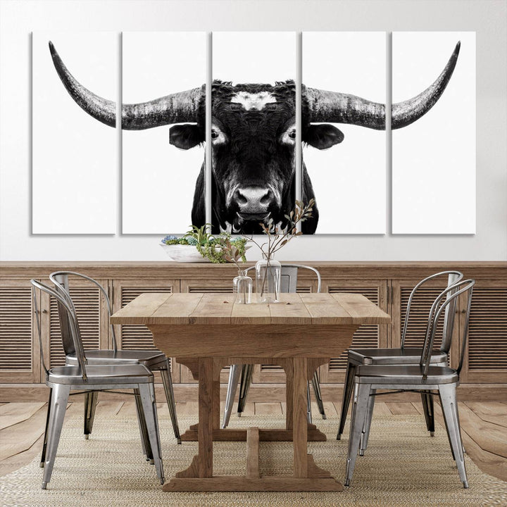 The living room is adorned with the Texas Cow Longhorn Wall Art Canvas Print in Black and White—framed and ready to hang.