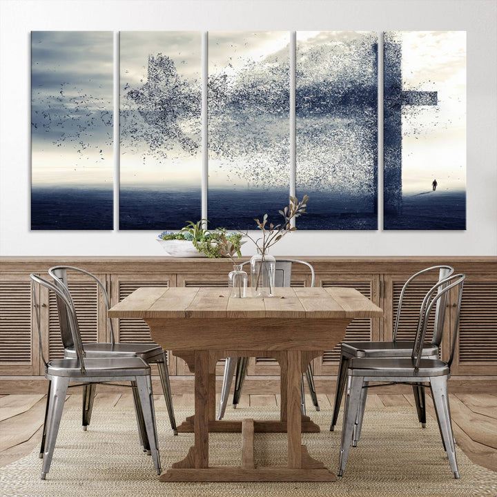 The "Jesus and the Fading Cross – Symbol of Faith" framed canvas print beautifully depicts a cross formed by birds against a moody sky above an ocean. This piece of Christian wall art infuses spirituality into the minimalist space.