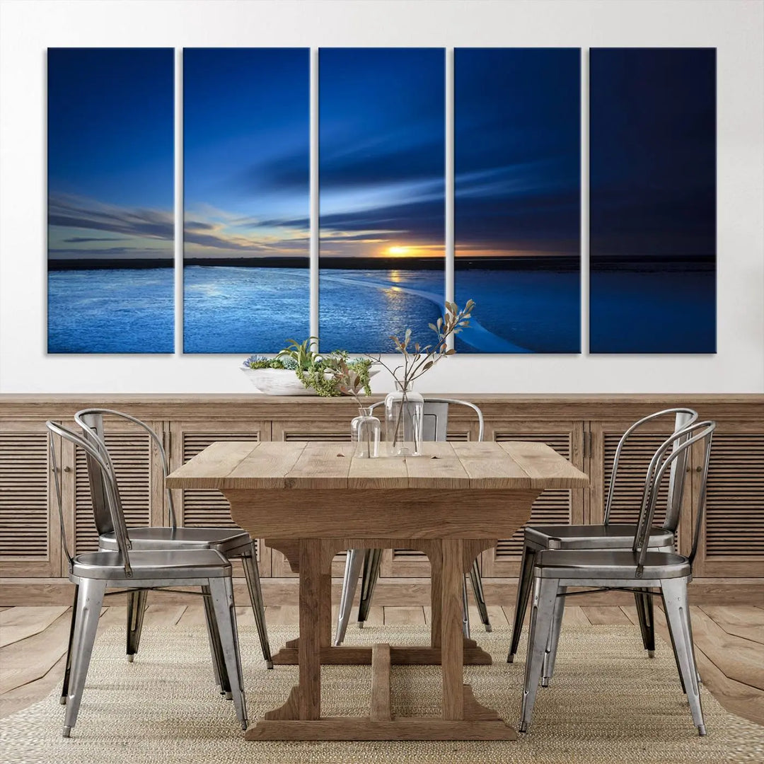 The living room features a triptych of the Wall Art Canvas Print Navy Sunset Lake Landscape Artwork, adding to its tranquil vibe.