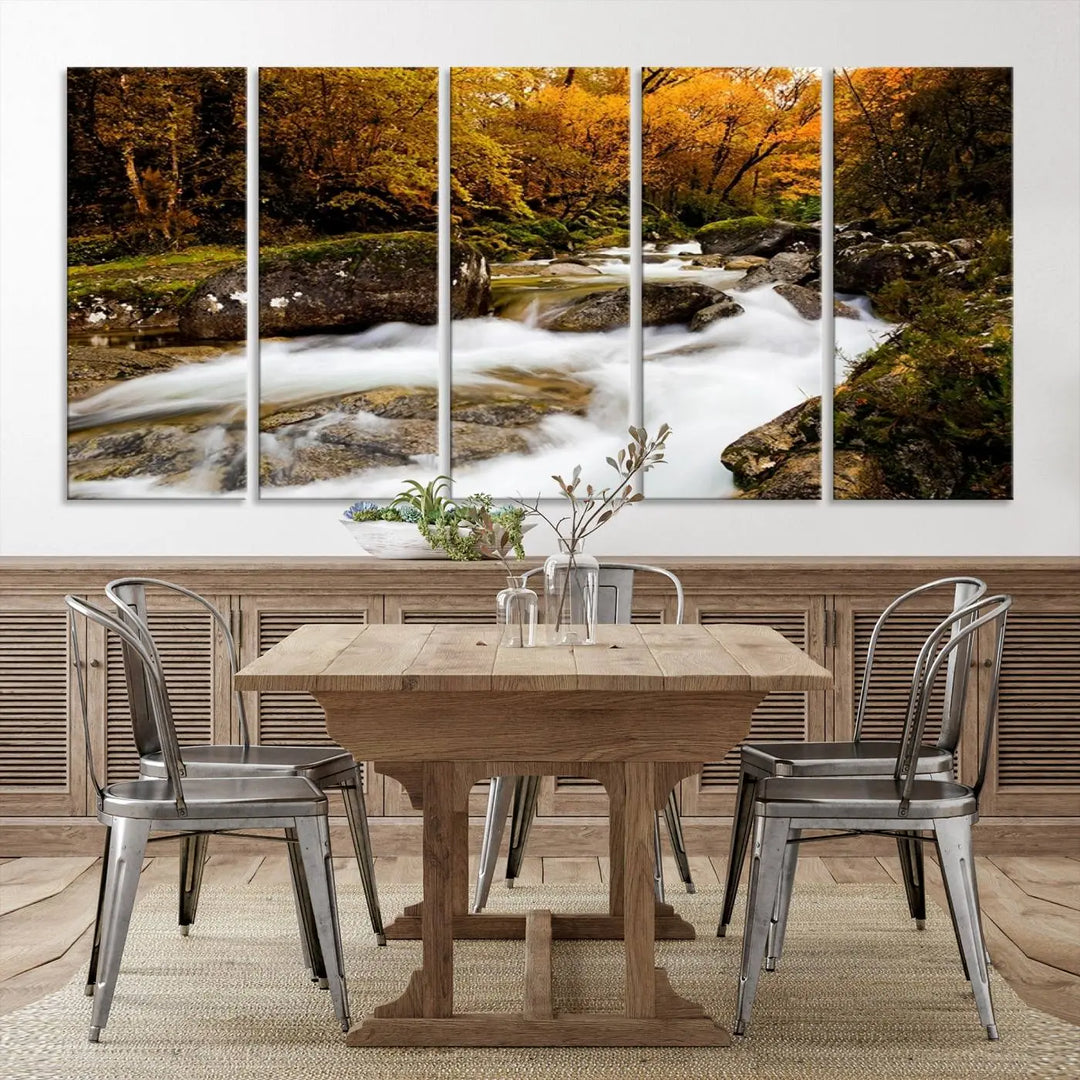 The living room is adorned with the "Wall Art Waterfall Canvas Print River in Forest in Autumn," a triptych on museum-quality canvas showcasing a flowing river surrounded by autumn trees. This ready-to-hang artwork features a UV-protective coating to ensure enduring vibrancy.