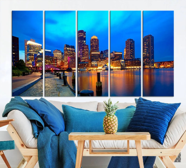 A triptych of the "Boston City Lights Night Blue Skyline Cityscape View Wall Art Canvas Print" adorns the wall. This museum-quality canvas artwork is ready to hang and includes a UV-protective coating for lasting brilliance.