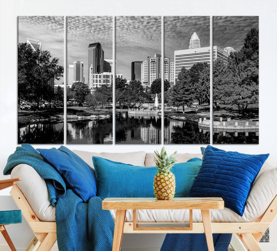 The living room features a captivating triptych titled "Charlotte City Cloudy Skyline Black and White Wall Art Cityscape Canvas Print," crafted on museum-quality canvas with UV-protective coating. Modern decor accentuates the dynamic scene.