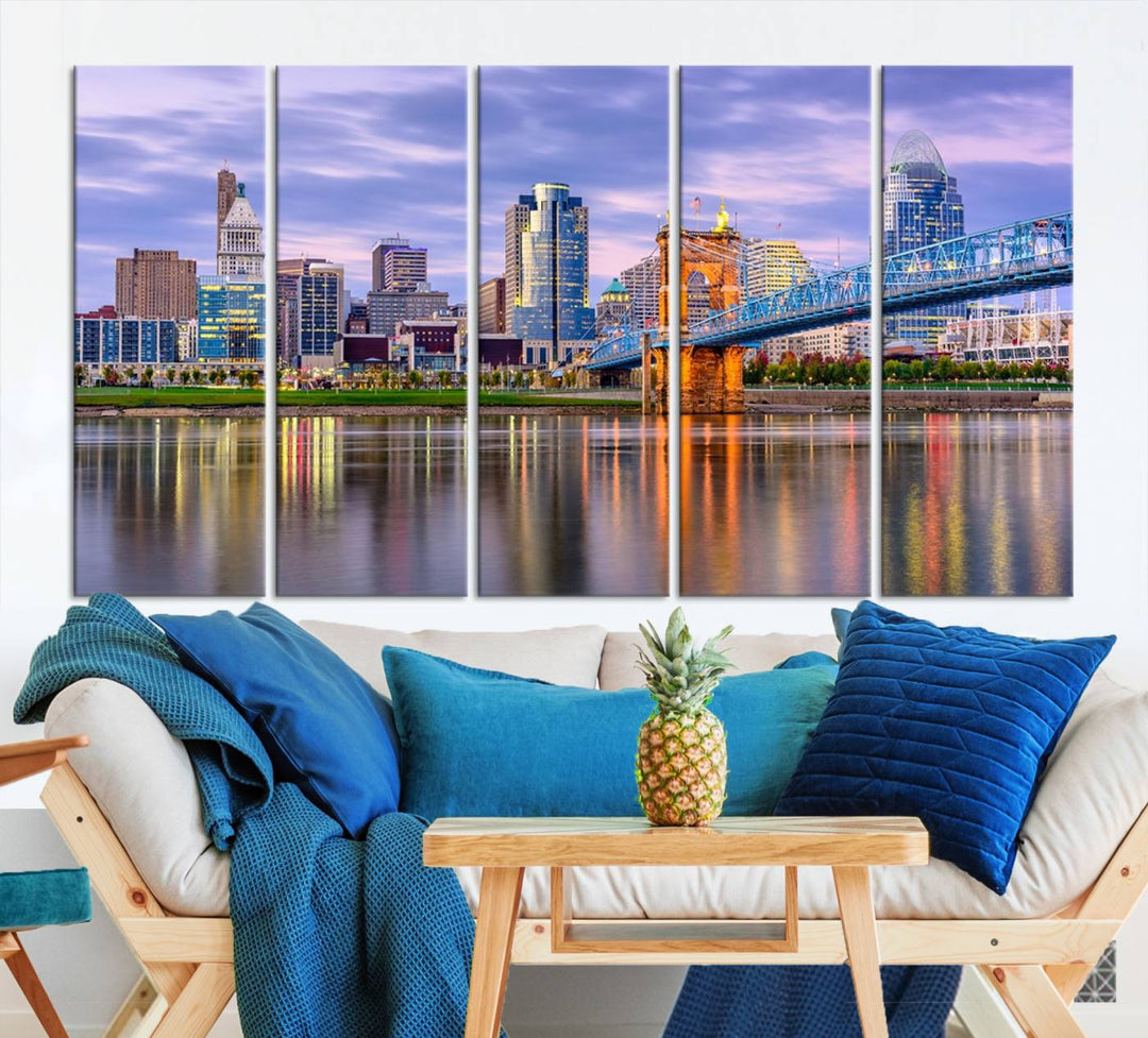 The wall art titled "Cincinnati City Lights Sunset Purple Cloudy Skyline Cityscape View" is beautifully printed on museum-quality canvases with a UV-protective coating and is ready to hang.