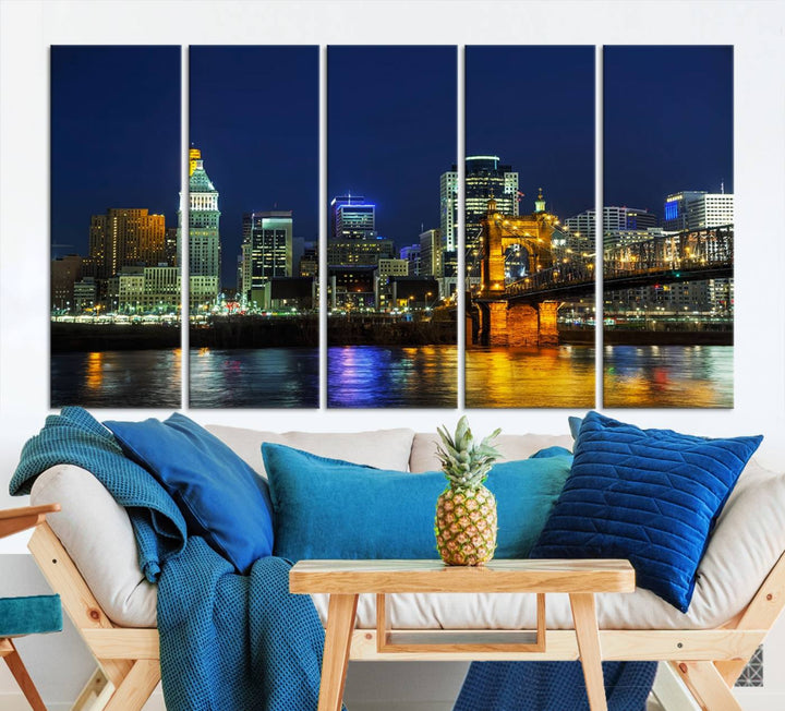 The "Cincinnati City Lights Night Skyline Cityscape" canvas print, displayed above a sofa, exhibits museum-quality craftsmanship with a UV-protective coating.