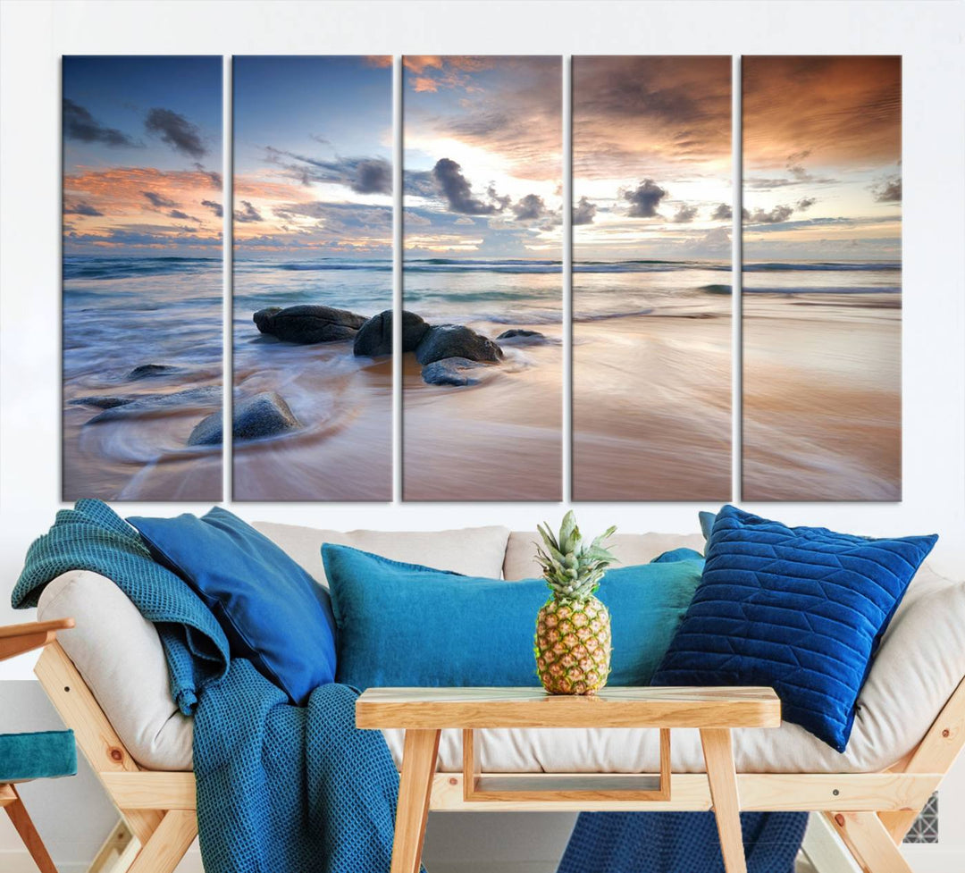 The "Serene Weather On The Beach Wall Art Canvas Print," featuring a tranquil beach scene with rocks and waves, is ready to hang and enjoy.