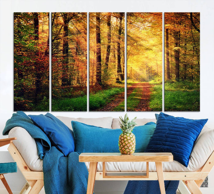 The Sunlight Through Trees Wall Art Canvas Print showcases a sunlit forest path in autumn on gallery-wrapped, museum-quality canvas with UV-protective coating.