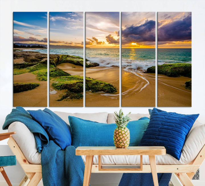 The Sunset Beach Wall Art Canvas Print is a gallery-wrapped triptych showcasing a beach scene with mossy rocks and a vibrant sunset. Made from museum-quality canvas and featuring a UV-protective coating, it elegantly provides both beauty and durability.