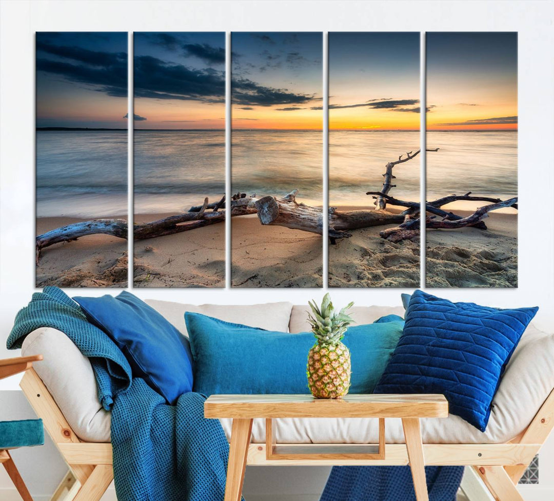 A captivating piece of Ocean Sunset Beach Wall Art Canvas Print, gallery wrapped, graces the gray wall.