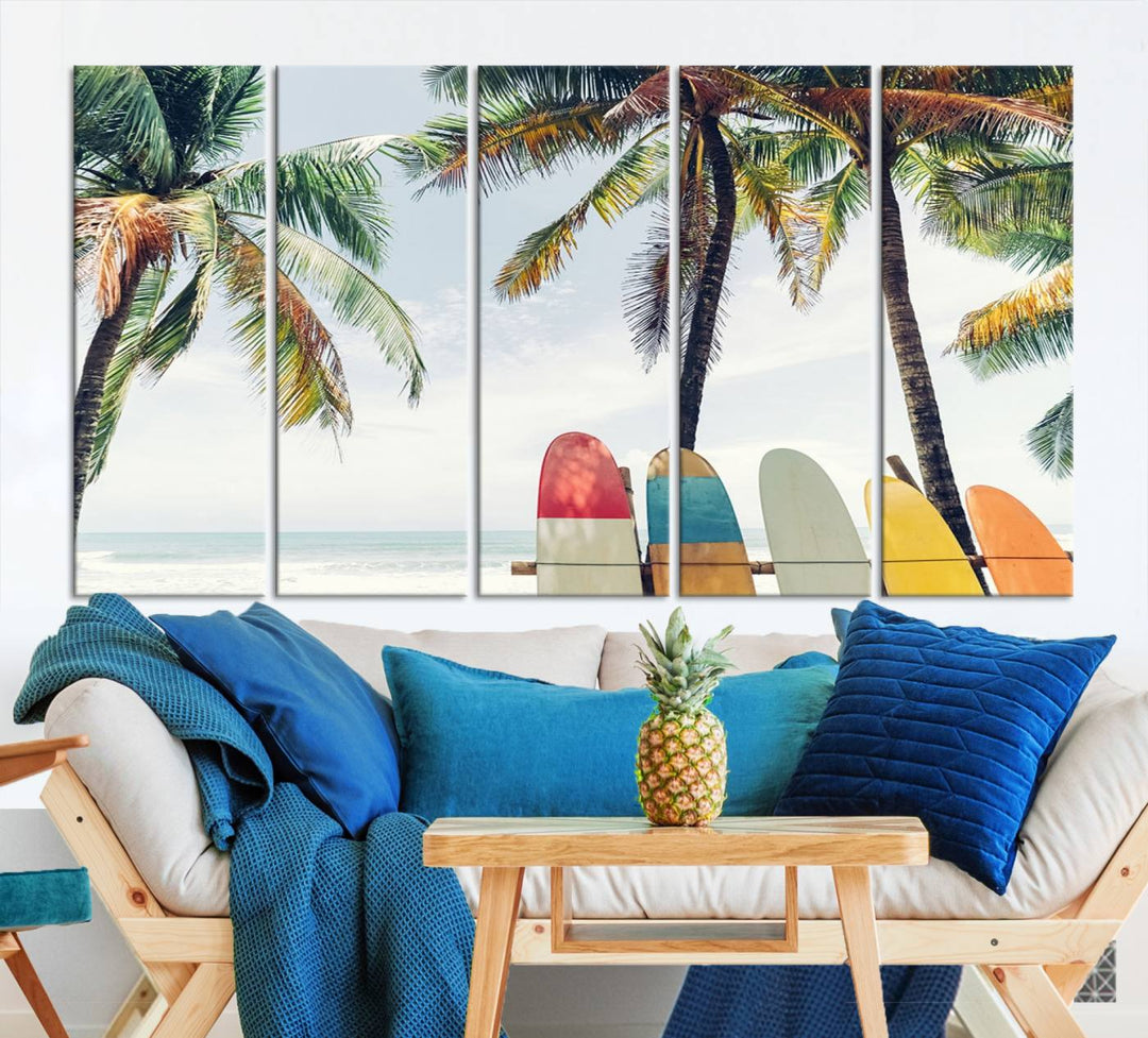 The room showcases The Palm and Surfing Board Wall Art Canvas Print, a triptych of palm trees and surfboards by the beach, elegantly gallery wrapped for a sophisticated finish.