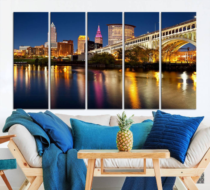 The "Cleveland Night Skyline Wall Art City Cityscape Canvas Print" is a striking feature in the room, showcasing a city skyline with a bridge reflecting in a river. Displayed on museum-quality canvas, it offers enduring beauty.