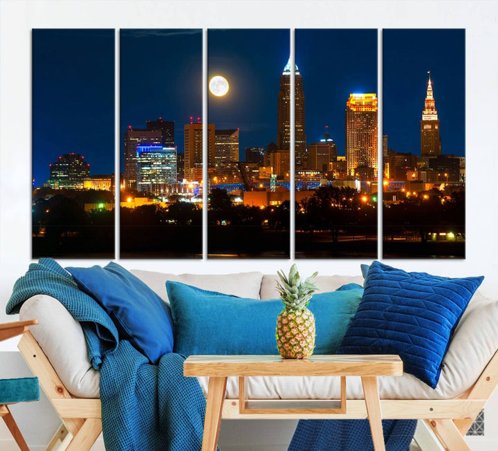 The "Cleveland Night Skyline Wall Art City Cityscape Canvas Print" adds elegance to the room with its depiction of a city skyline and full moon on museum-quality canvas. The artwork is enhanced by a UV-protective coating to ensure lasting brilliance.