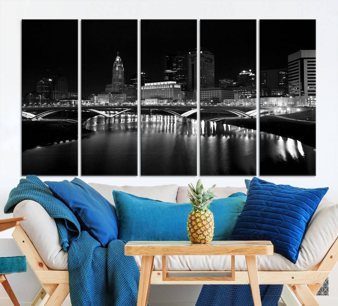 The living room features the "Columbus City Lights Skyline Black and White Wall Art Cityscape Canvas Print" above a coffee table. This artwork is presented as a triptych on museum-quality canvases with UV-protective coating.