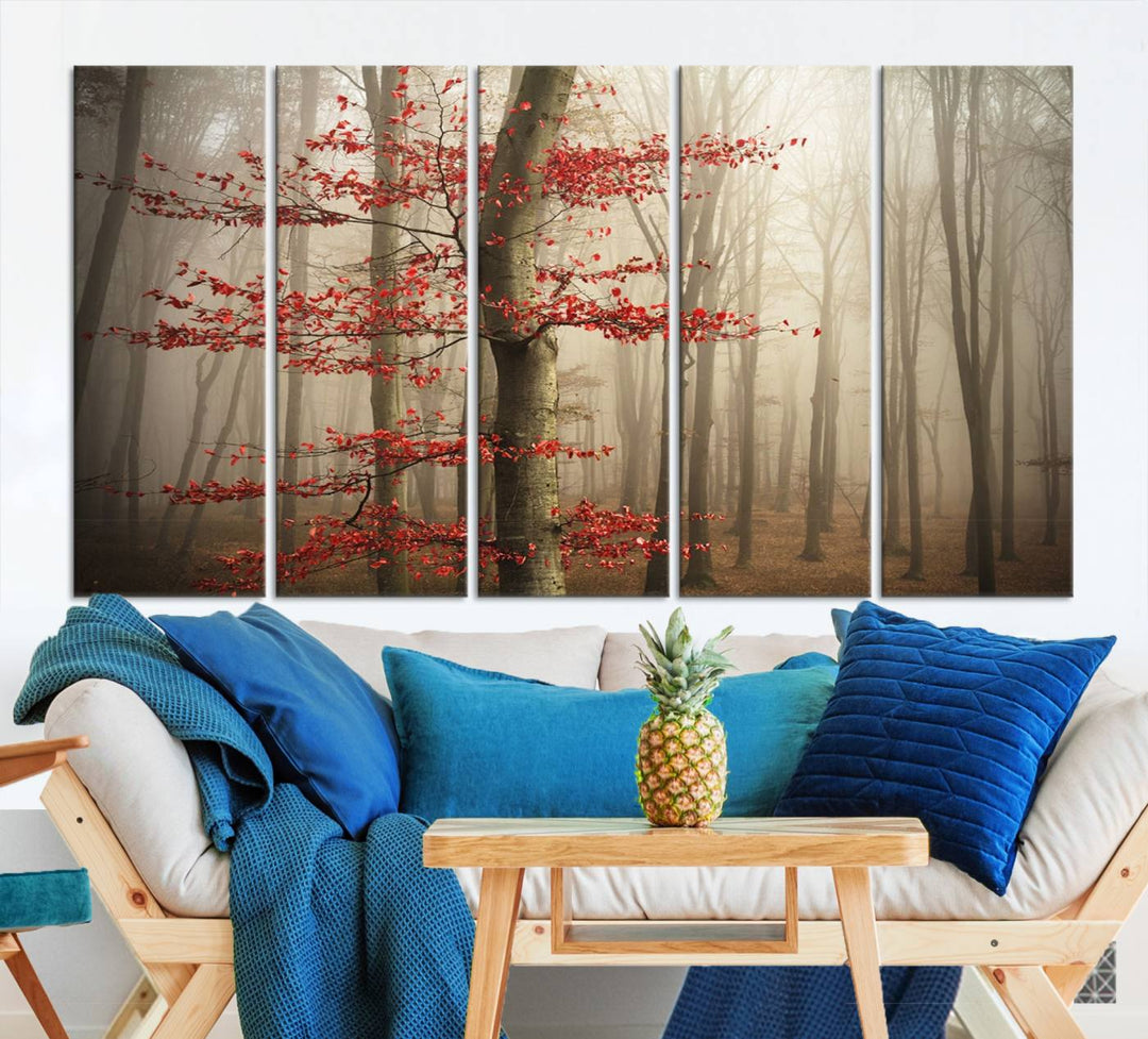 The living room features the Foggy Forest Wall Art, an Autumn Trees Canvas Print that showcases a serene nature scene with foggy woodland decor and a tree adorned in vibrant red leaves.