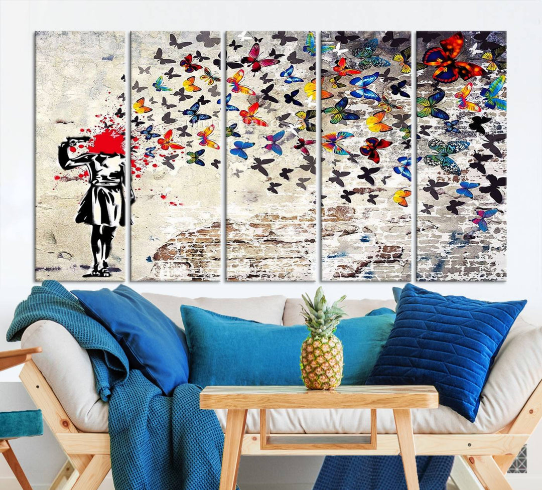 The Banksy Art Butterfly Girl Explosion Canvas showcases a dynamic figure with butterflies bursting from their head, set against a textured wall background. This vibrant urban graffiti piece is perfect for modern interiors and comes ready to hang.