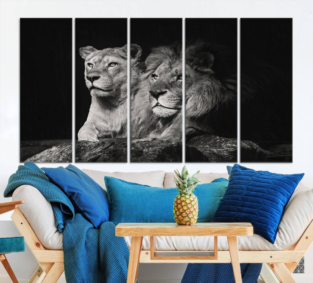 The elegant wildlife portrait, "Lion Couple Canvas Wall Art Print," featuring a black and white depiction of a lion family, majestically decorates the living room wall.