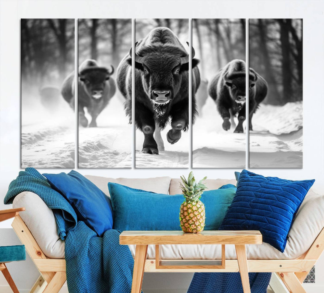 Transform your living room with the Buffalo Wall Art Canvas Print triptych, showcasing a bison family in motion across a snowy landscape. This striking Western decor piece becomes the focal point of any room.