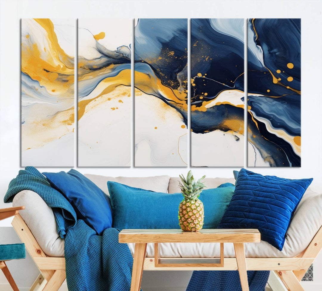 The Blue and Gold Abstract Fluid Canvas Art, with its swirling patterns, adorns the wall. This modern wall art beautifully complements the contemporary interior decor, adding an elegant touch with its rich blue, gold, and white tones.