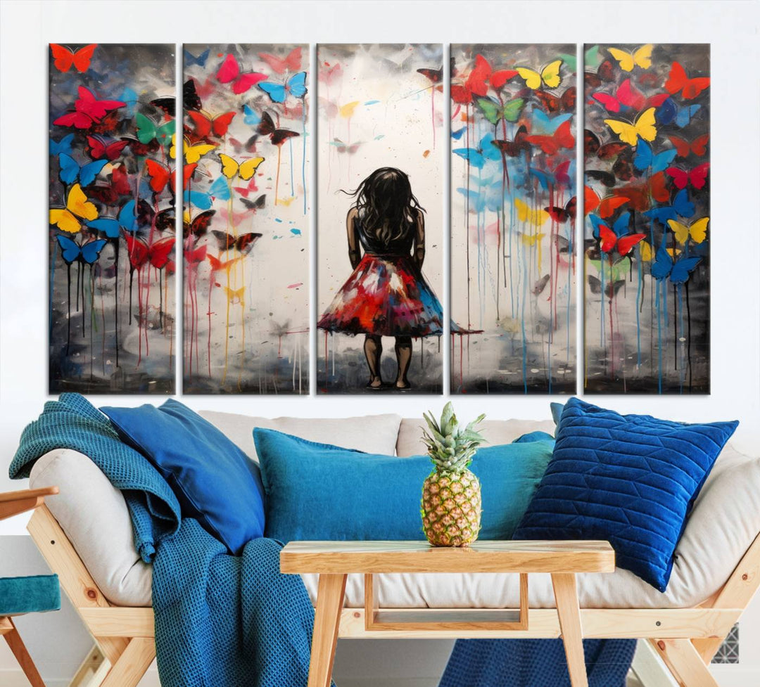 The Girl Butterfly Graffiti Abstract Canvas Print, featuring a vibrant depiction of a girl surrounded by butterflies on museum-quality canvas, is displayed prominently.