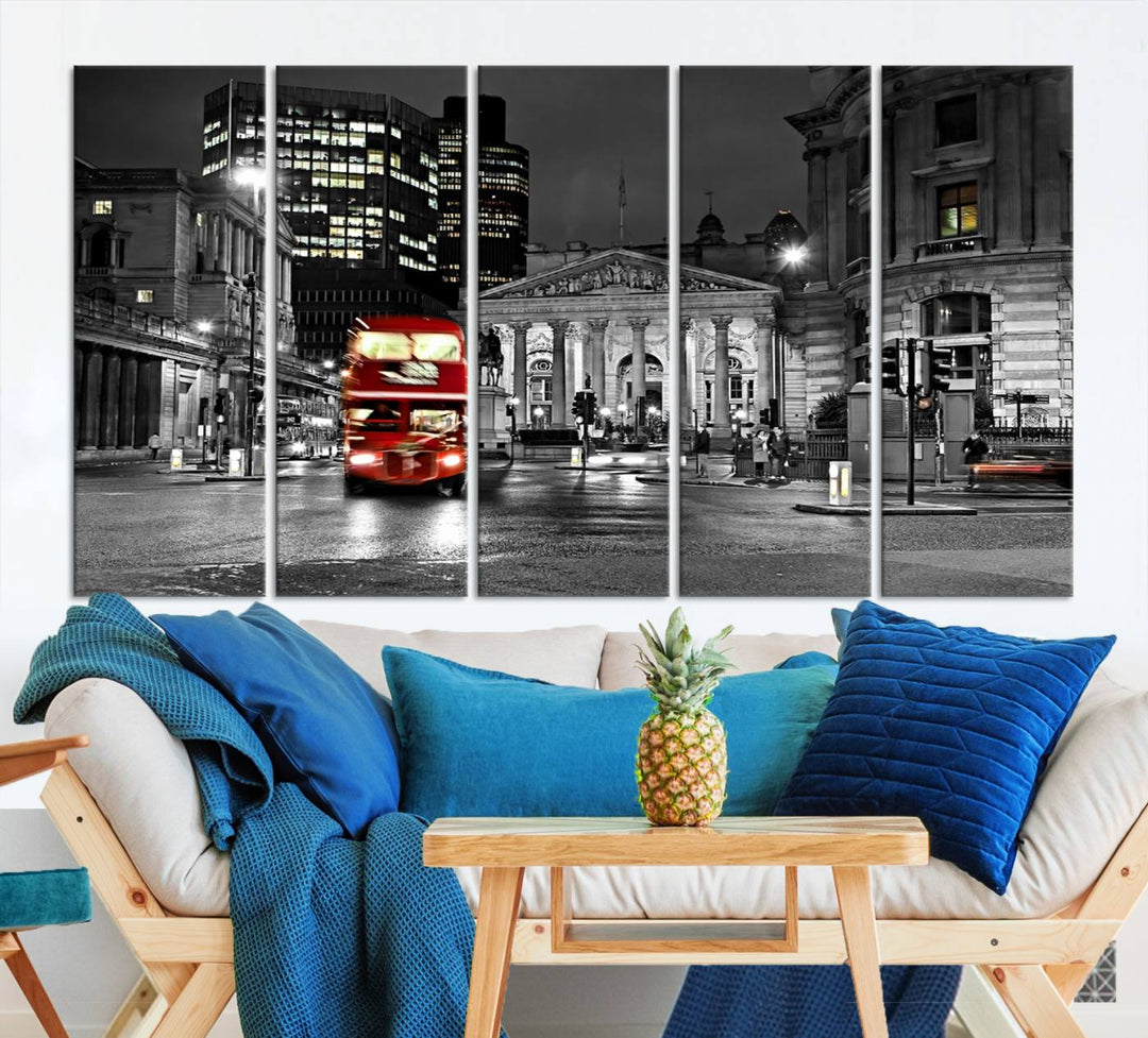 The London Night Red Bus Wall Art Canvas Print features a black and white cityscape with a moving red double-decker bus, crafted on museum-quality canvas with a UV-protective coating. This ready-to-hang artwork is designed to stand out and enhance any space.