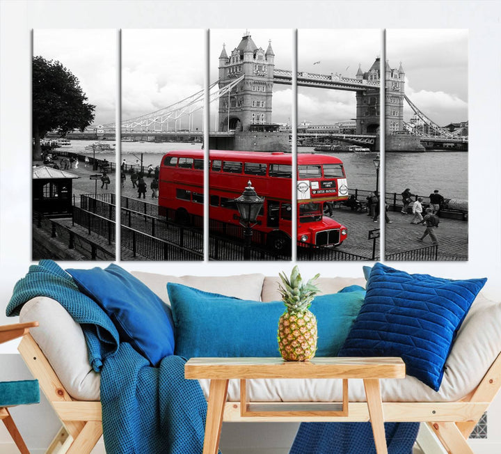 The London Red Bus and Bridge Wall Art Canvas Print showcases a red London bus in front of Tower Bridge, beautifully presented as a gallery-wrapped canvas. This striking image is divided into three panels, delivering a museum-quality display that's ready to hang.