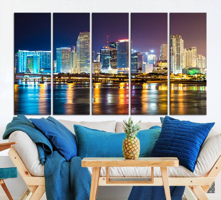 The Wall Art MIAMI Canvas Print features a stunning triptych of a city skyline at night, with vibrant lights reflecting on the water. This gallery-wrapped piece on museum-quality canvas delivers an exquisite finish.