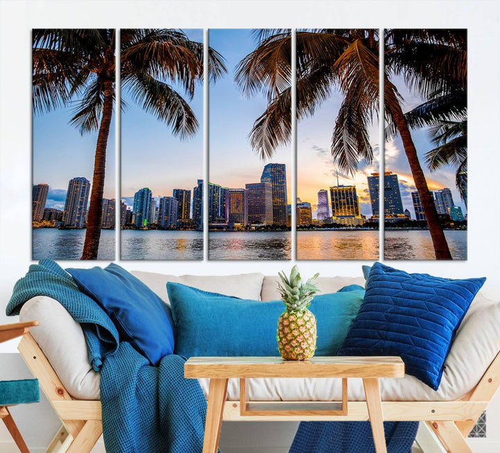 The Wall Art MIAMI Canvas Print features a triptych design depicting palm trees and a city skyline at sunset.