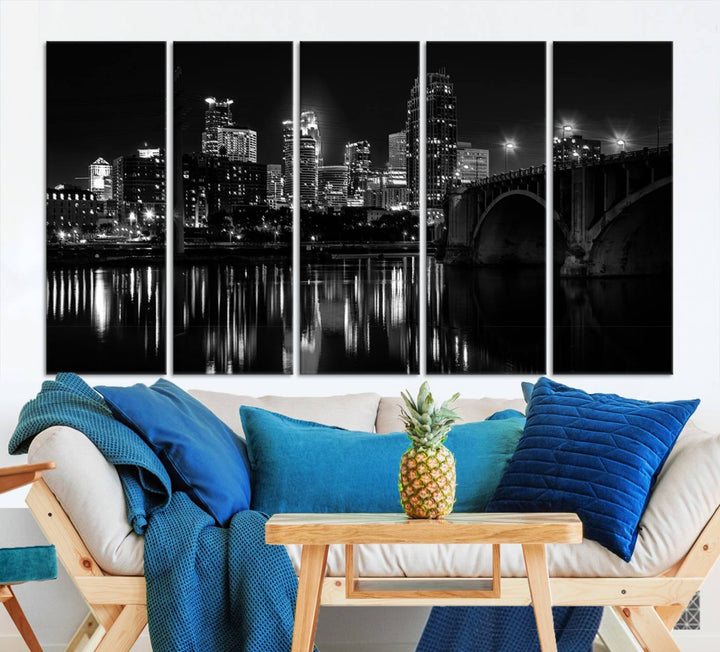 The "Minneapolis Wall Art Canvas Print, Minnesota City Wall Art Print, Minnesota Cityscapes Wall Art" features a black and white triptych of a city skyline with a bridge. Crafted on museum-quality canvas, this gallery-wrapped artwork is finished with a UV-protective coating to ensure lasting beauty.